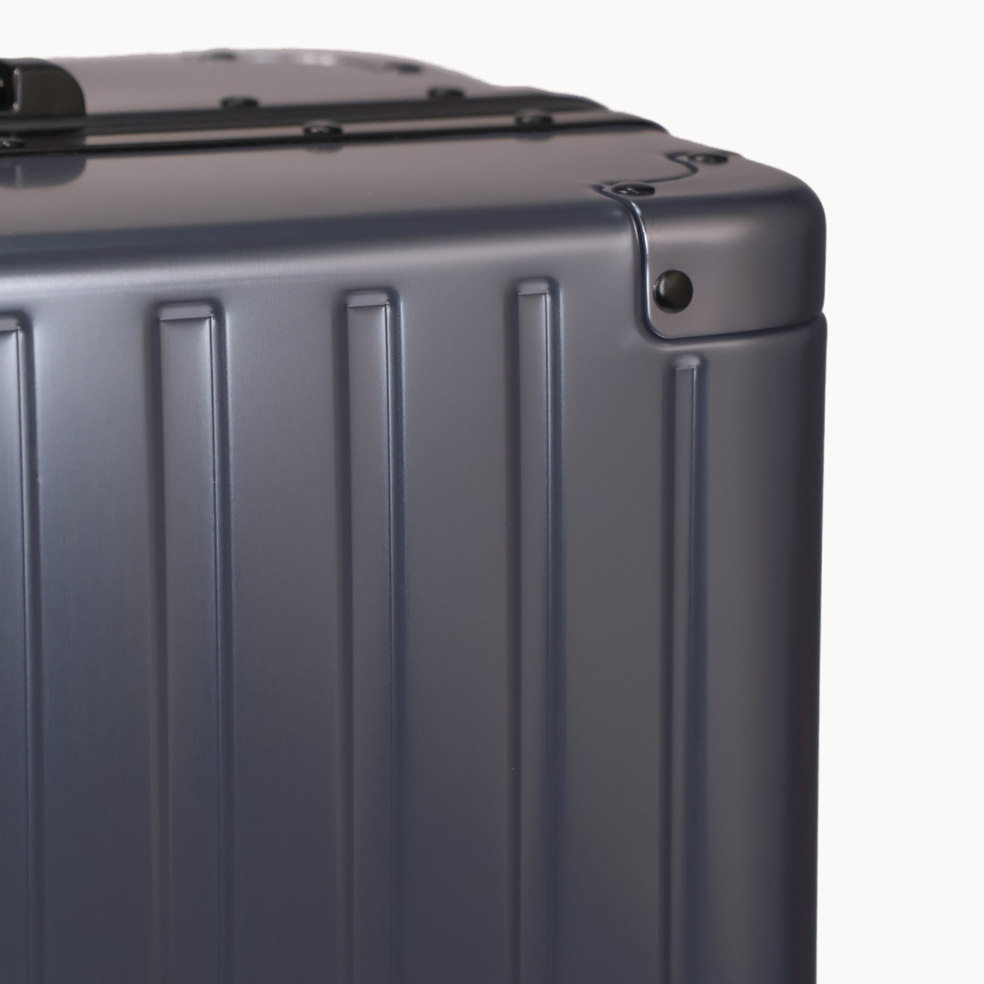CHAVELLE luxury aluminium suitcase gun metal close-up of reinforced corners