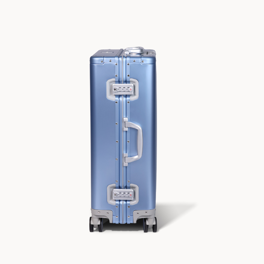 CHAVELLE aluminium suitcase blue close-up of TSA-approved lock and side handle