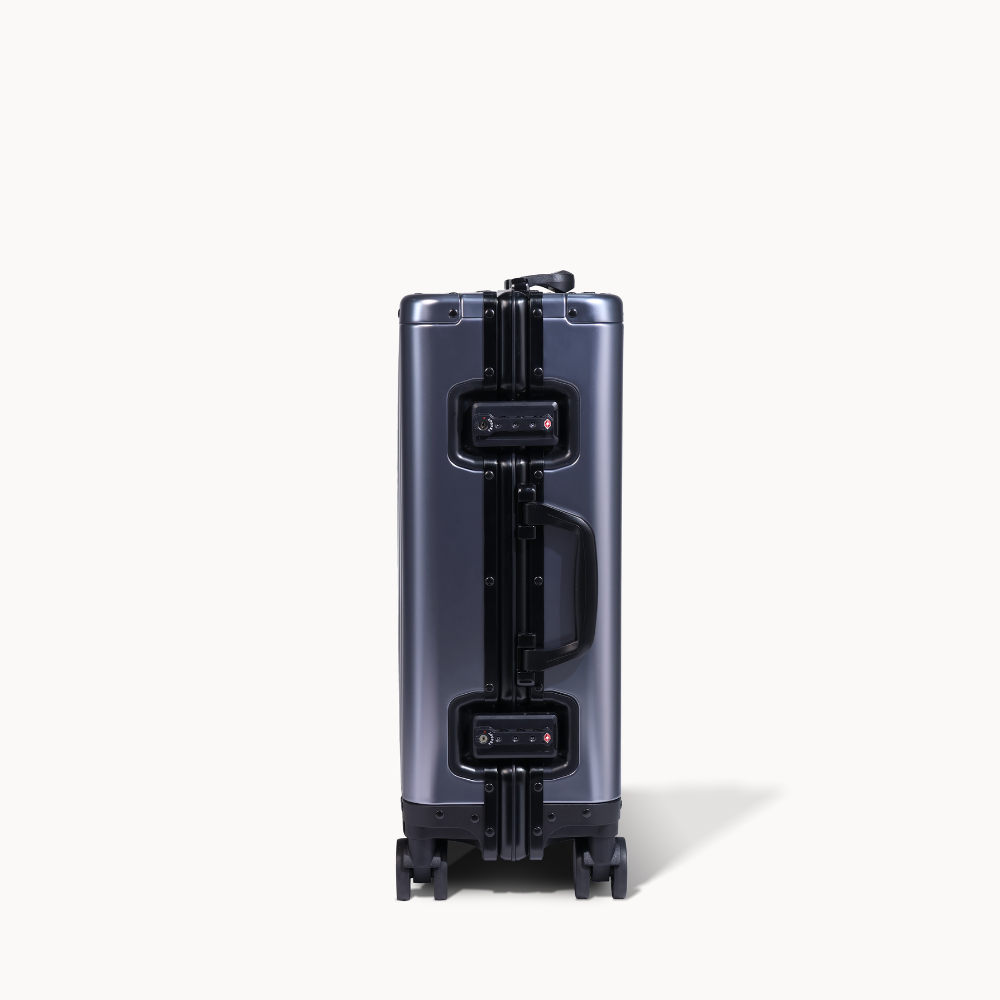 CHAVELLE aluminium suitcase gun metal close-up of TSA-approved lock and side handle