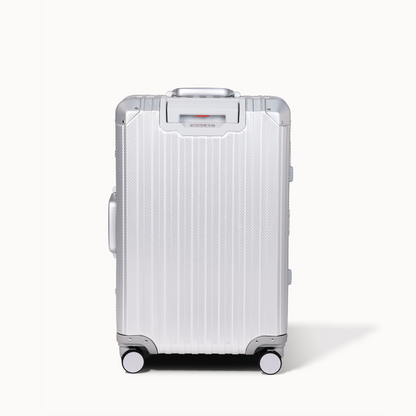 Silver suitcase with visible brand logo on a white background