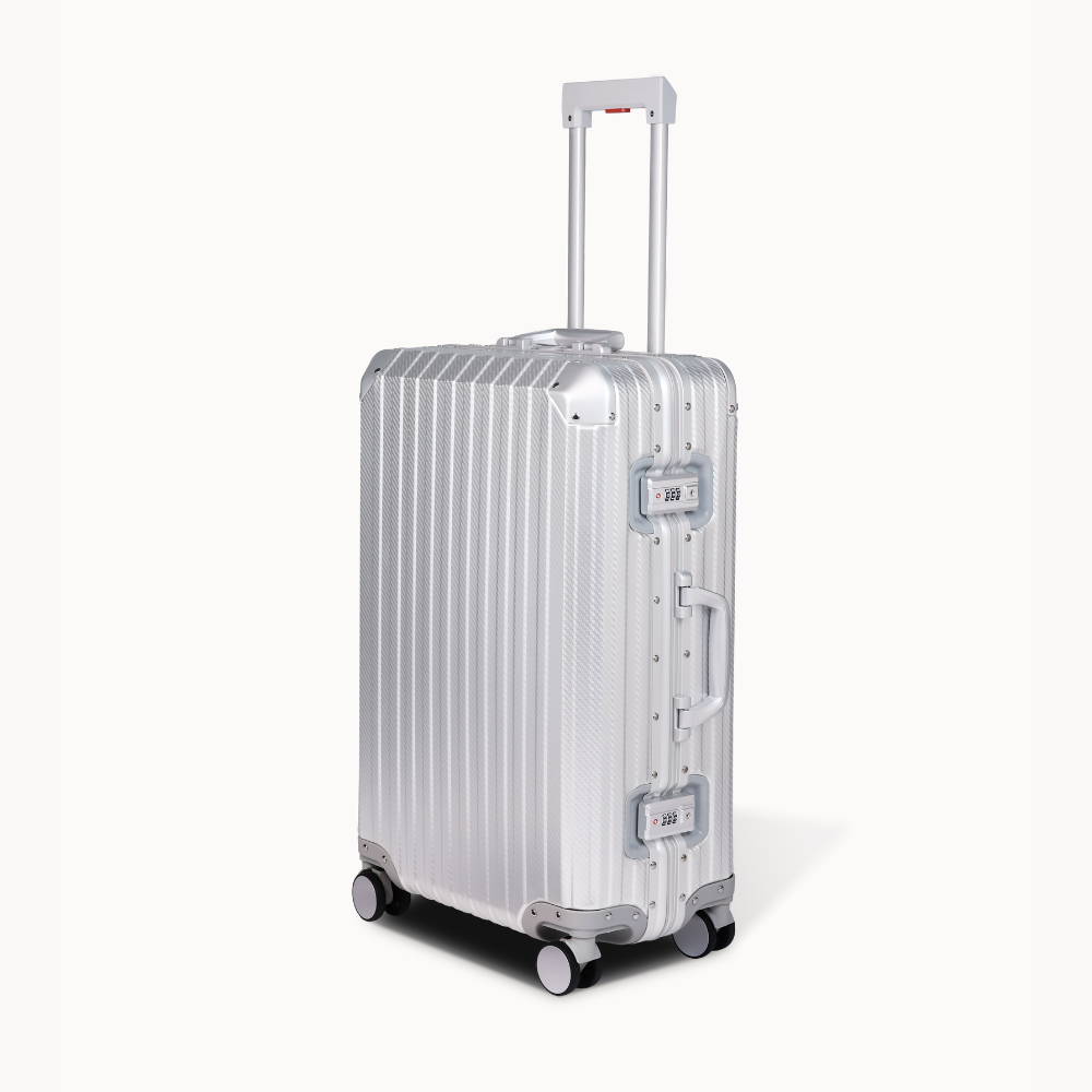 Silver suitcase with wheels on a white background