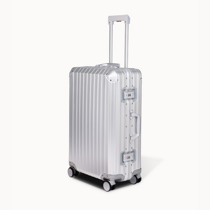 Silver suitcase with wheels on a white background