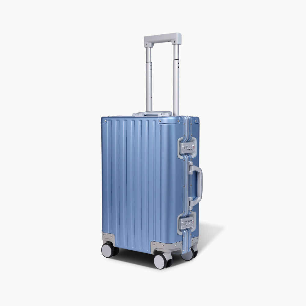 CHAVELLE aluminium suitcase blue angled view showing reinforced corners and sleek finish 