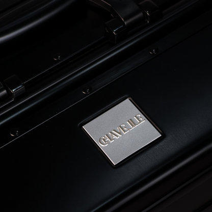 CHAVELLE luxury aluminium suitcase black close-up of top handle and metal logo