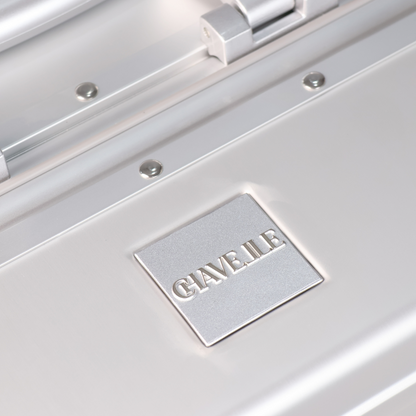 CHAVELLE luxury aluminium suitcase silver close-up of top handle and metal logo