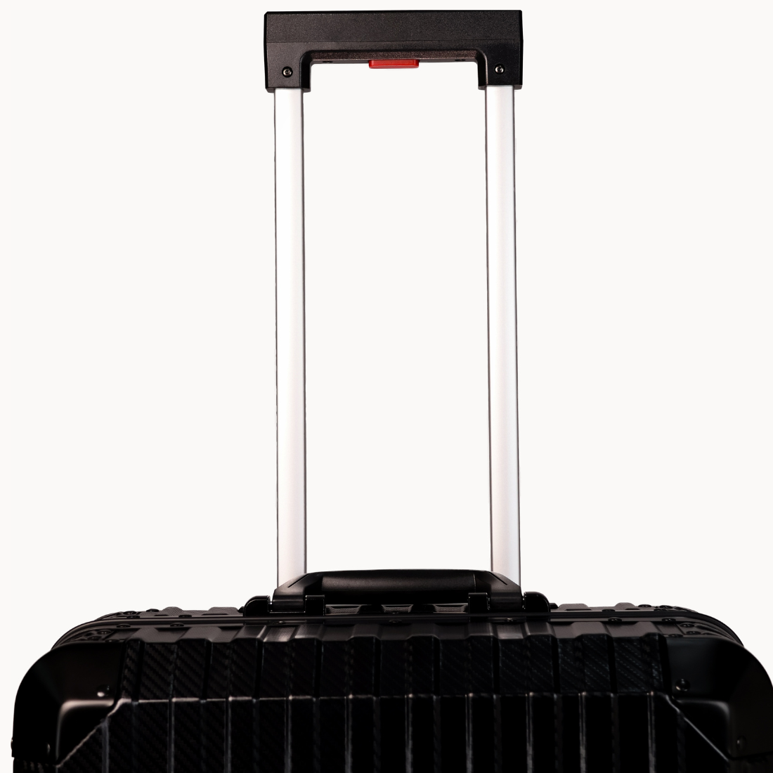 Black suitcase with a visible handle on a white background