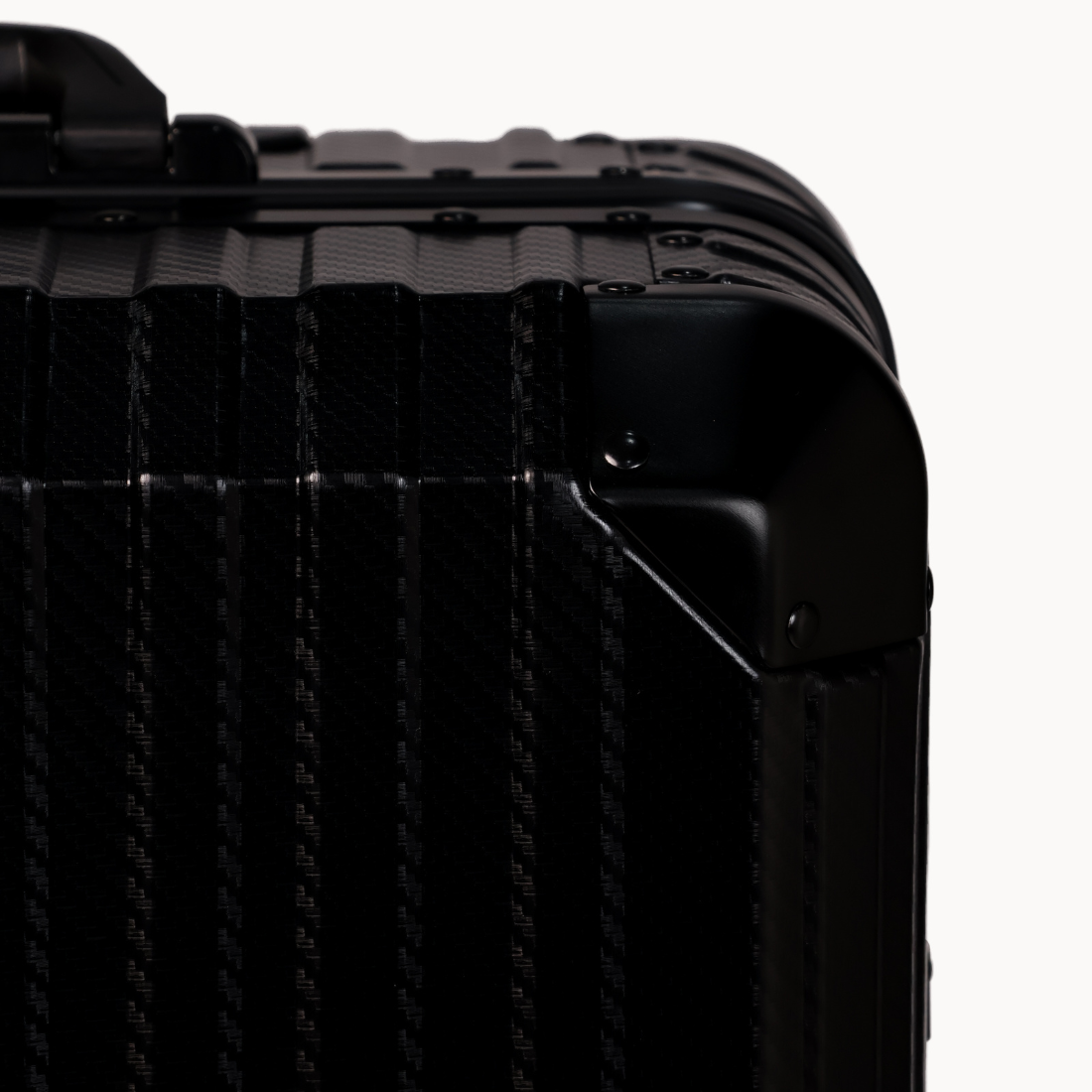 Close-up of a black suitcase with textured surface