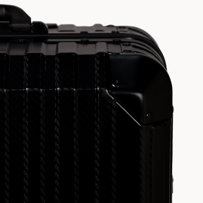 Close-up of a black suitcase with textured surface