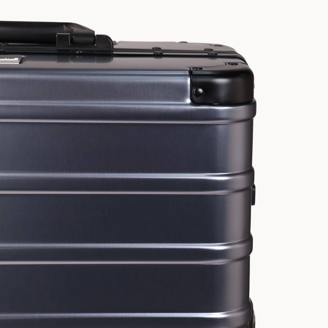 CHAVELLE luxury aluminium suitcase gun metal close-up of reinforced corners