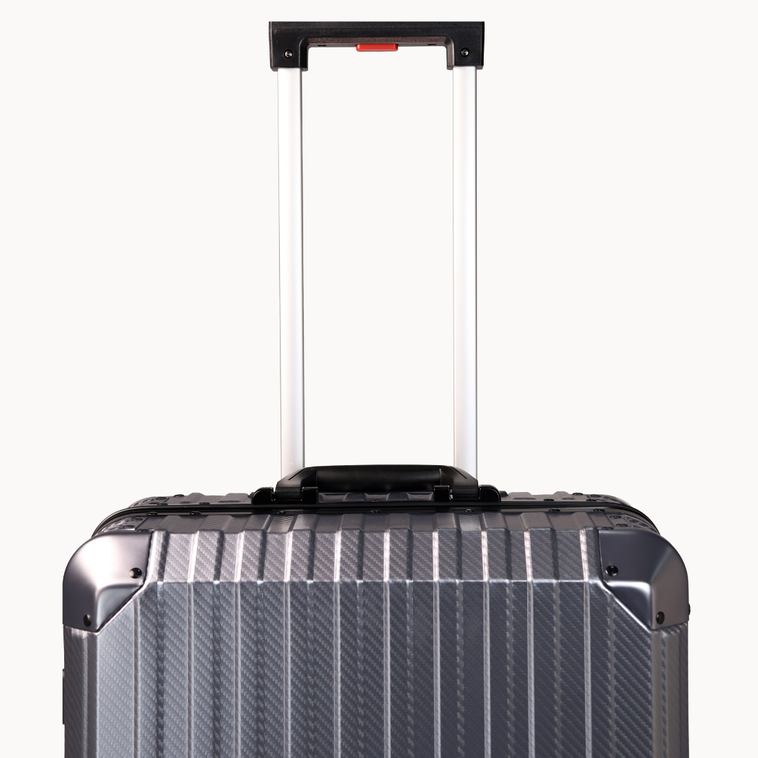 Silver suitcase with a black handle on a white background