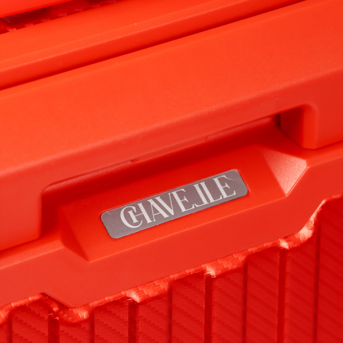 Close-up of a red container with 'CHAVELLE' logo on a red background