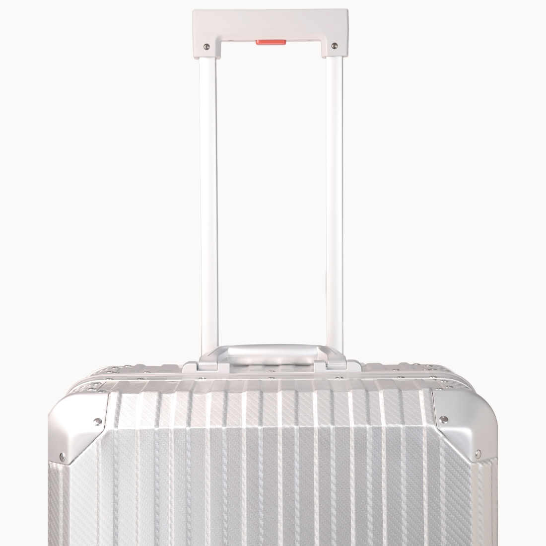 Silver suitcase with a white handle on a white background