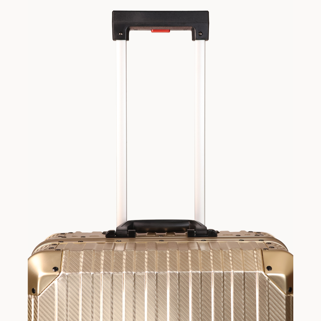 Gold suitcase with a black handle on a white background