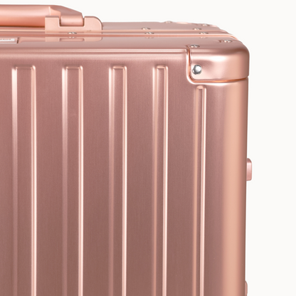 CHAVELLE luxury aluminium suitcase rose gold close-up of reinforced corners