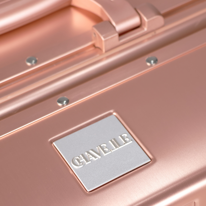 CHAVELLE luxury aluminium suitcase rose gold close-up of top handle and metal logo