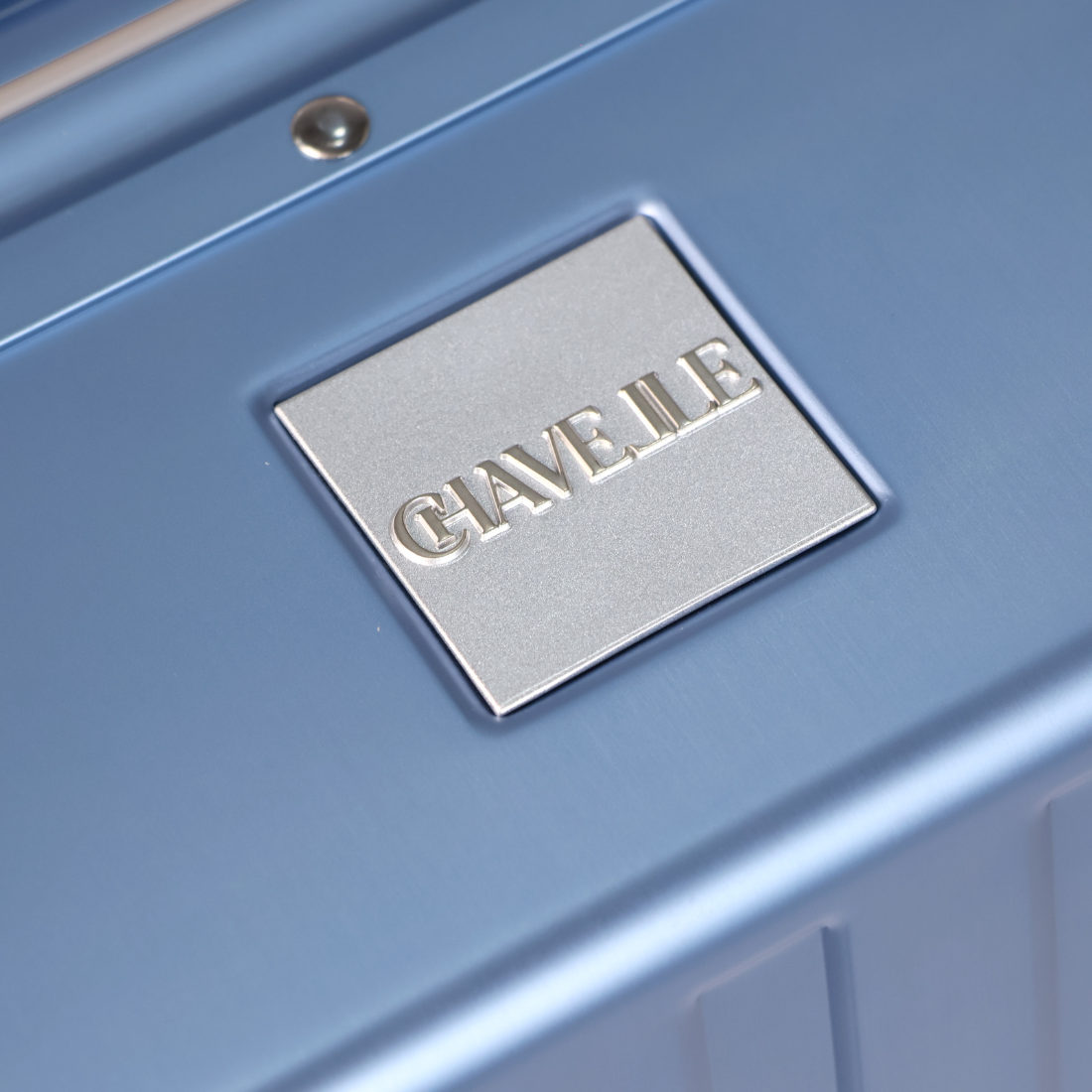 CHAVELLE luxury aluminium suitcase blue close-up of top handle and metal logo
