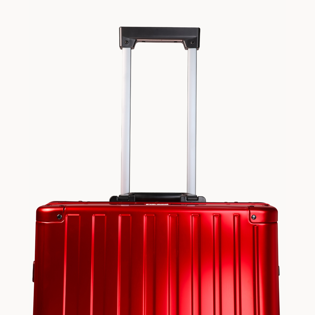 CHAVELLE luxury aluminium suitcase cherry red with reinforced corners and long open telescopic handle