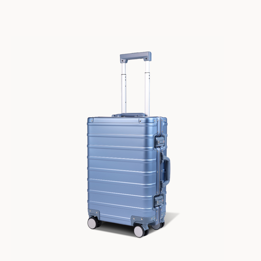 CHAVELLE aluminium suitcase ice blue angled view showing reinforced corners and sleek finish 
