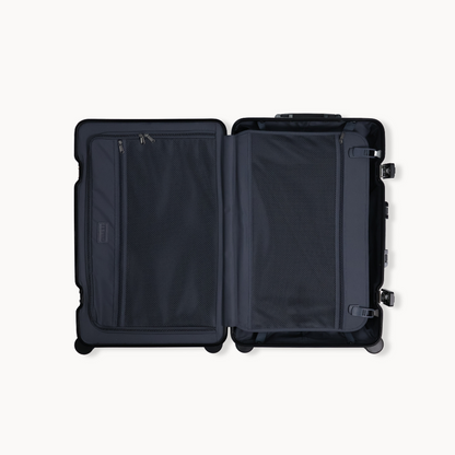 Black suitcase with open compartments on a white background