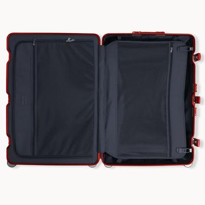 Open suitcase with red frame and black interior on a white background
