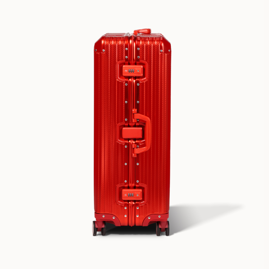 Red suitcase with a textured surface on a white background