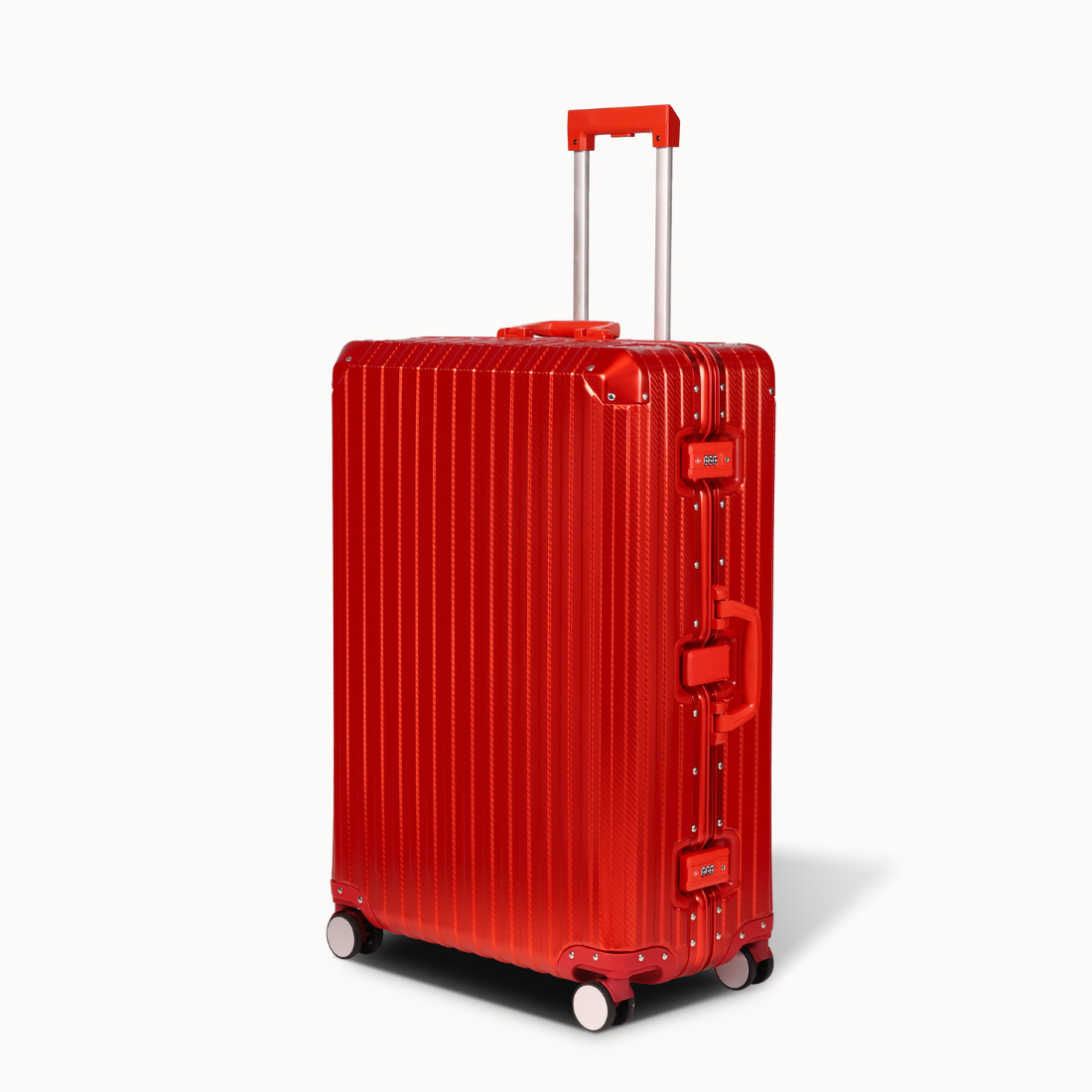 Red suitcase with a ribbed texture on a white background