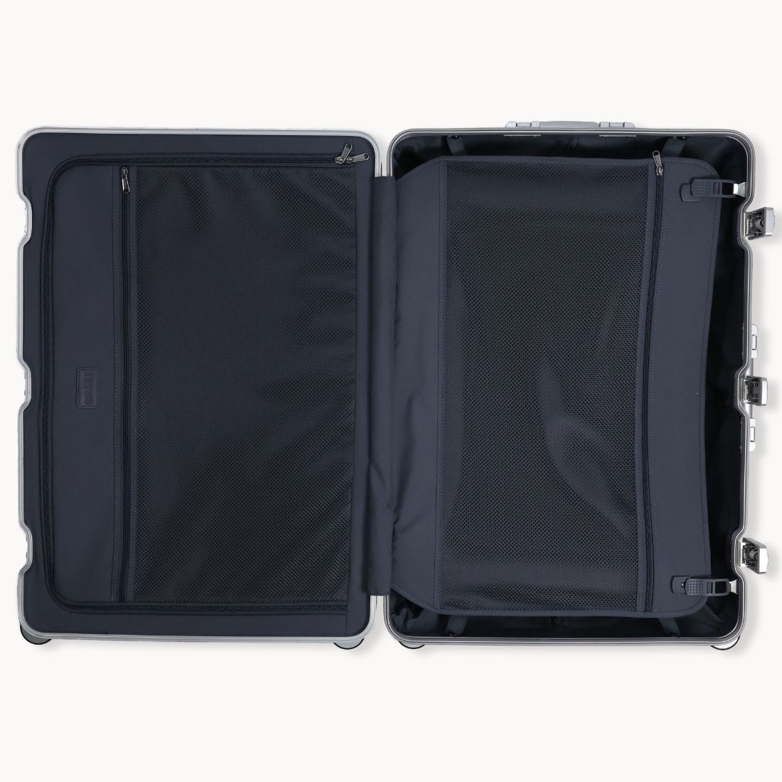 Black suitcase with open compartments on a white background