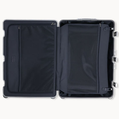Black suitcase with open compartments on a white background