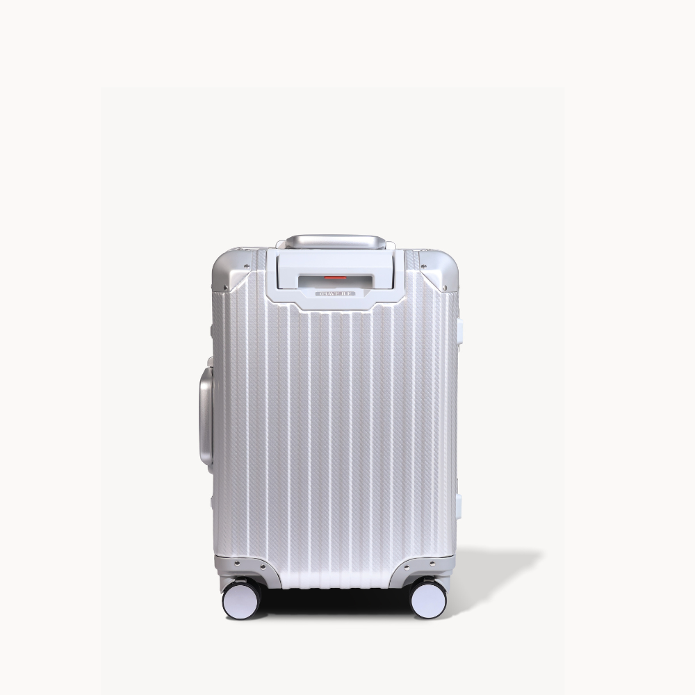 Silver suitcase with wheels on a white background
