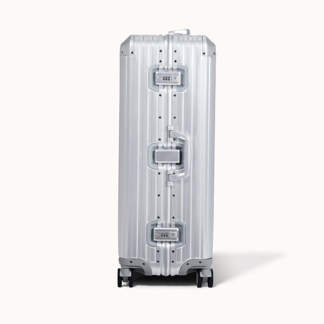 Silver suitcase with a reflective surface on a white background