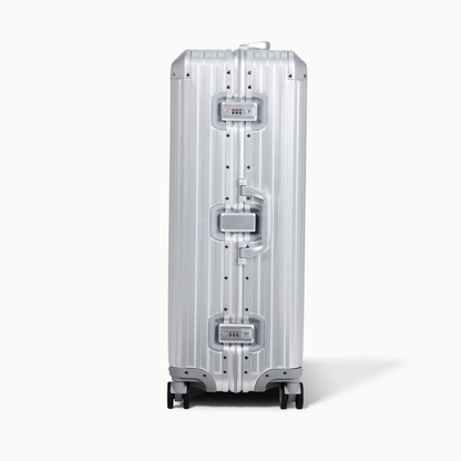 Silver suitcase with a reflective surface on a white background
