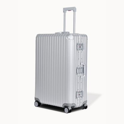 Silver suitcase with a striped pattern on a white background