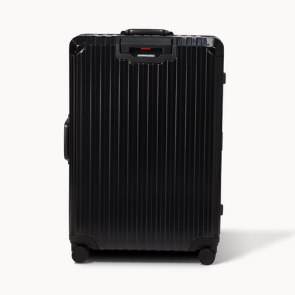 Black suitcase with visible brand name on a white background