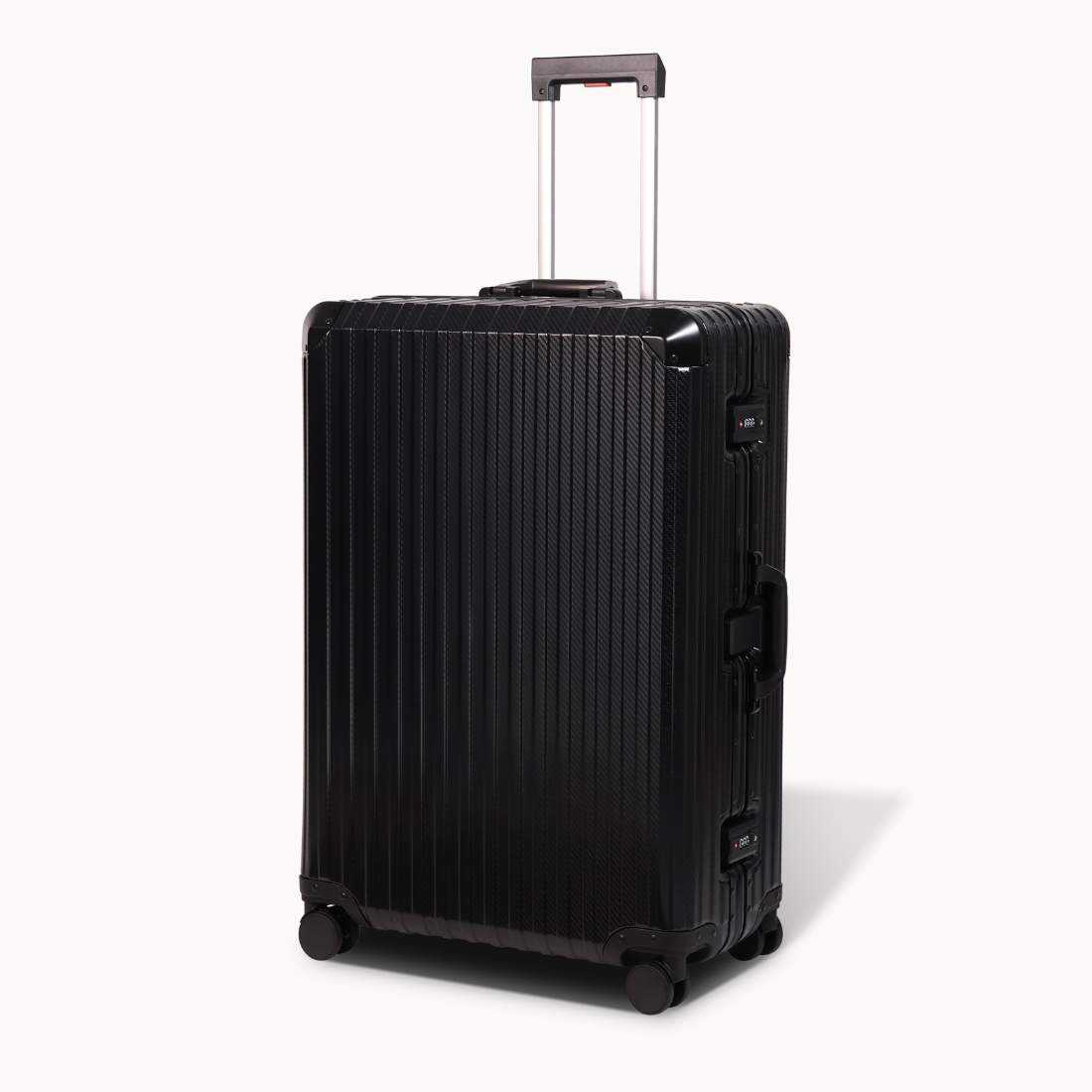 Black suitcase with wheels and handle on a white background