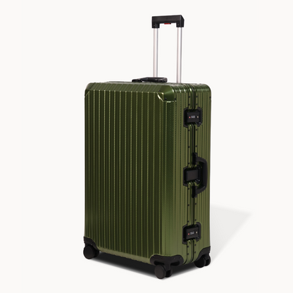 Green suitcase with black wheels and handle on a white background