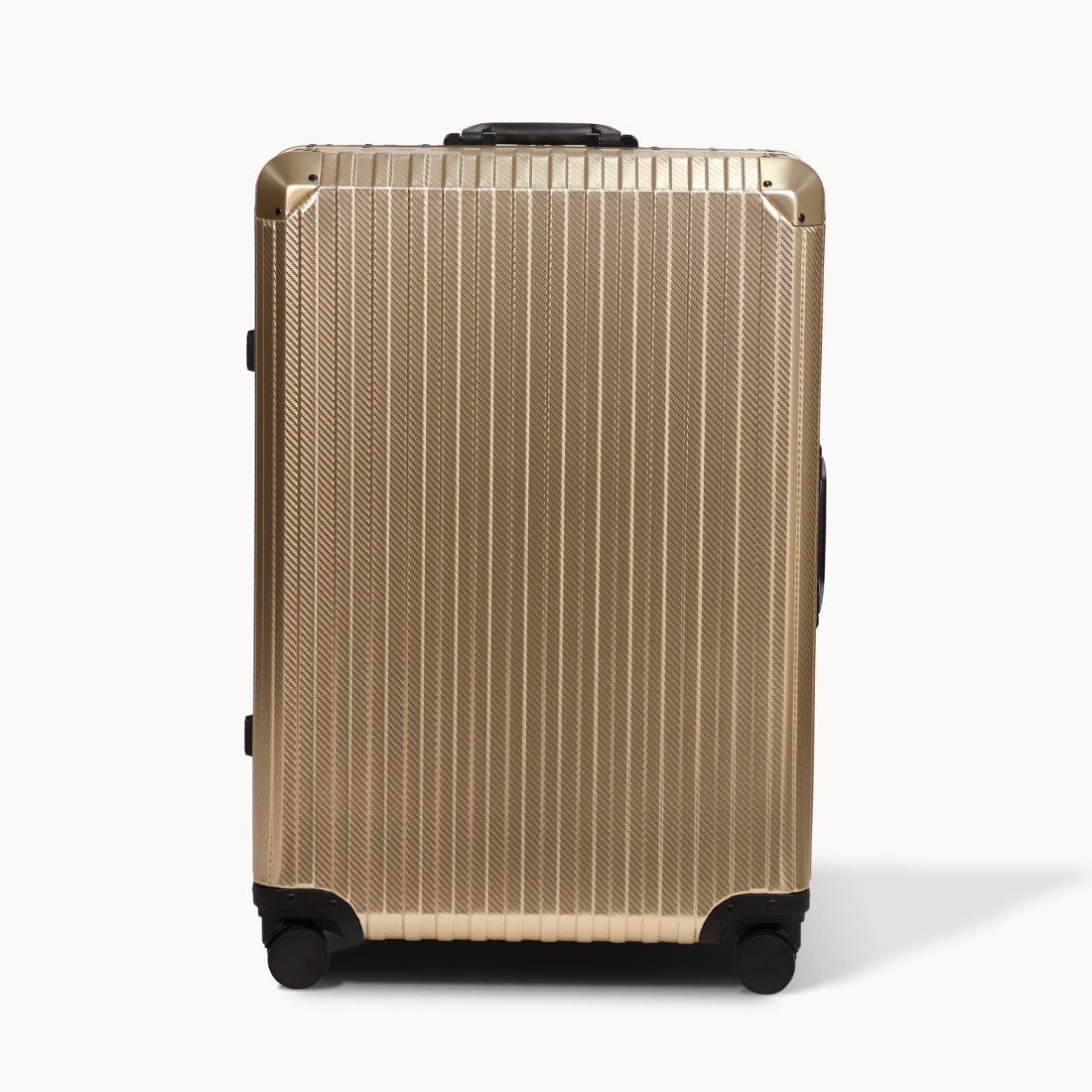 Gold suitcase with black wheels on a white background
