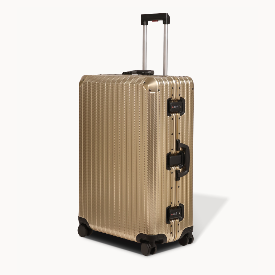 Gold suitcase with black accents on a white background