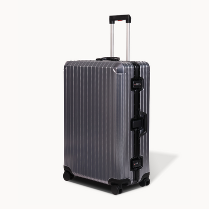 Silver suitcase with black accents on a white background