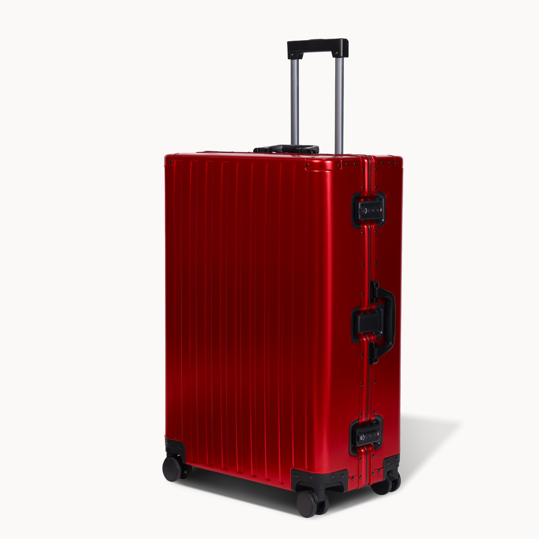 CHAVELLE aluminium suitcase cherry red angled view showing reinforced corners and sleek finish 