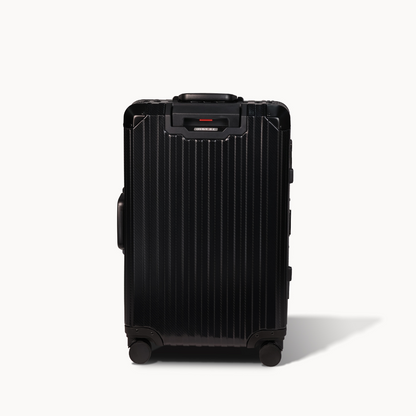 Black suitcase with a textured surface on a white background