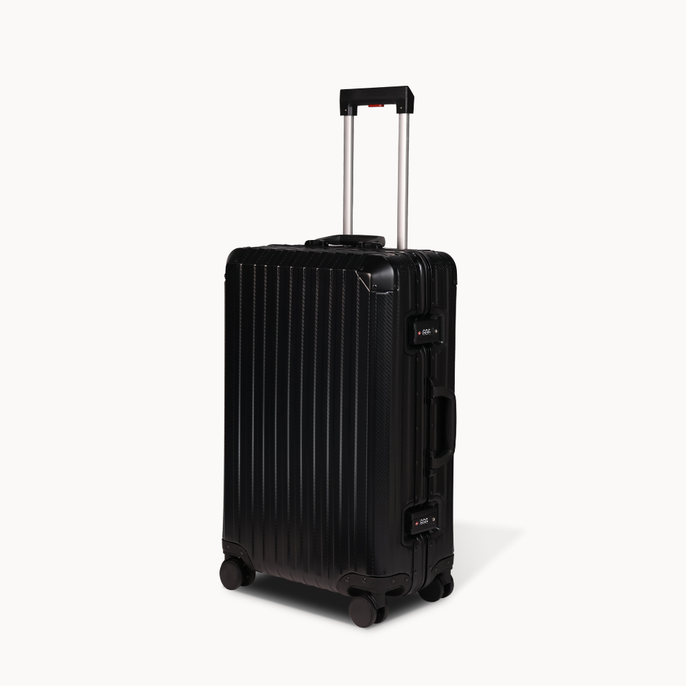 Black suitcase with a visible brand logo on a white background