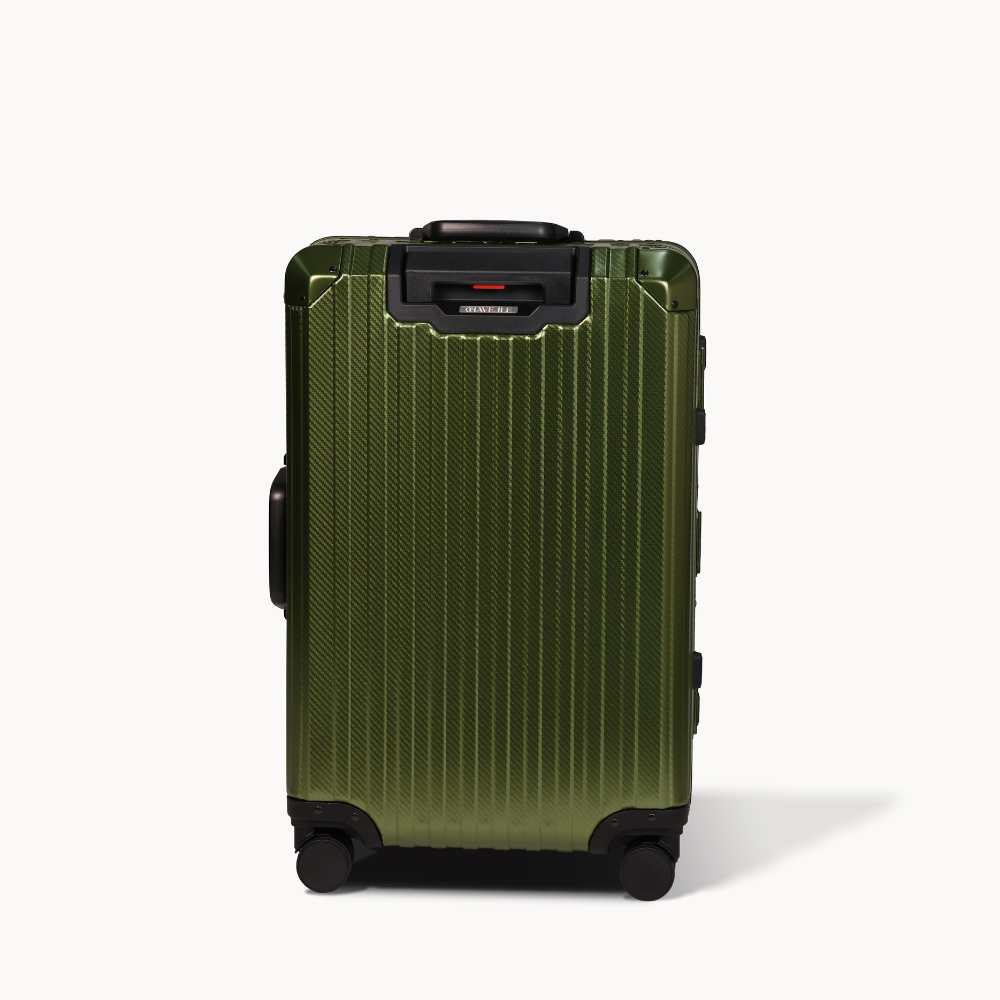 Green suitcase with black wheels on a white background