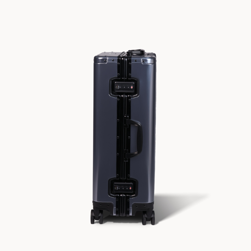 CHAVELLE aluminium suitcase gun metal close-up of TSA-approved lock and side handle