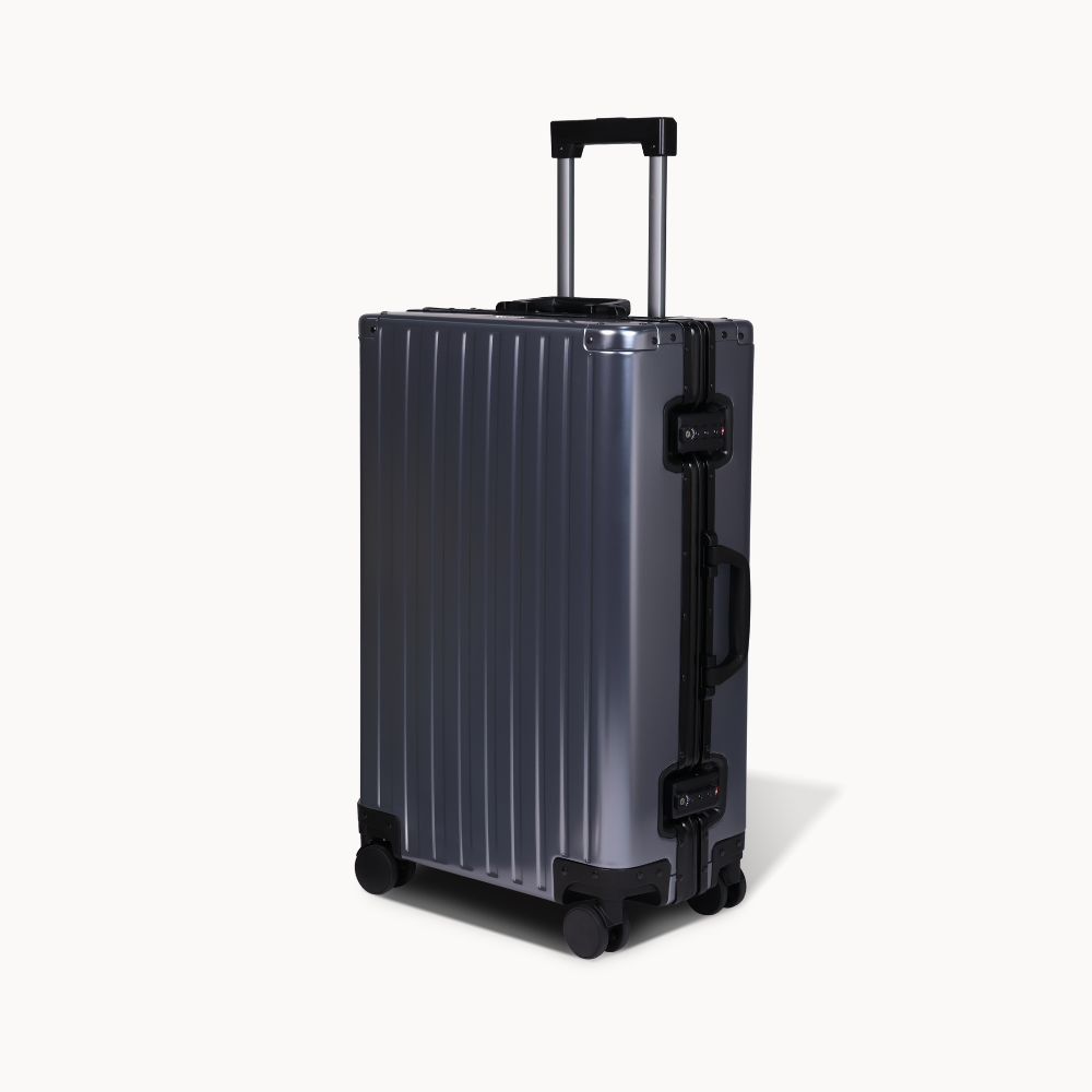 CHAVELLE aluminium suitcase gun metal angled view showing reinforced corners and sleek finish 