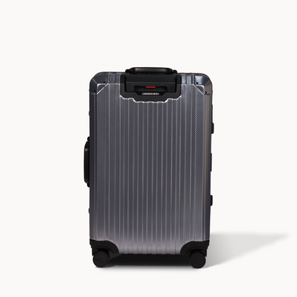 Black suitcase with a textured surface on a white background