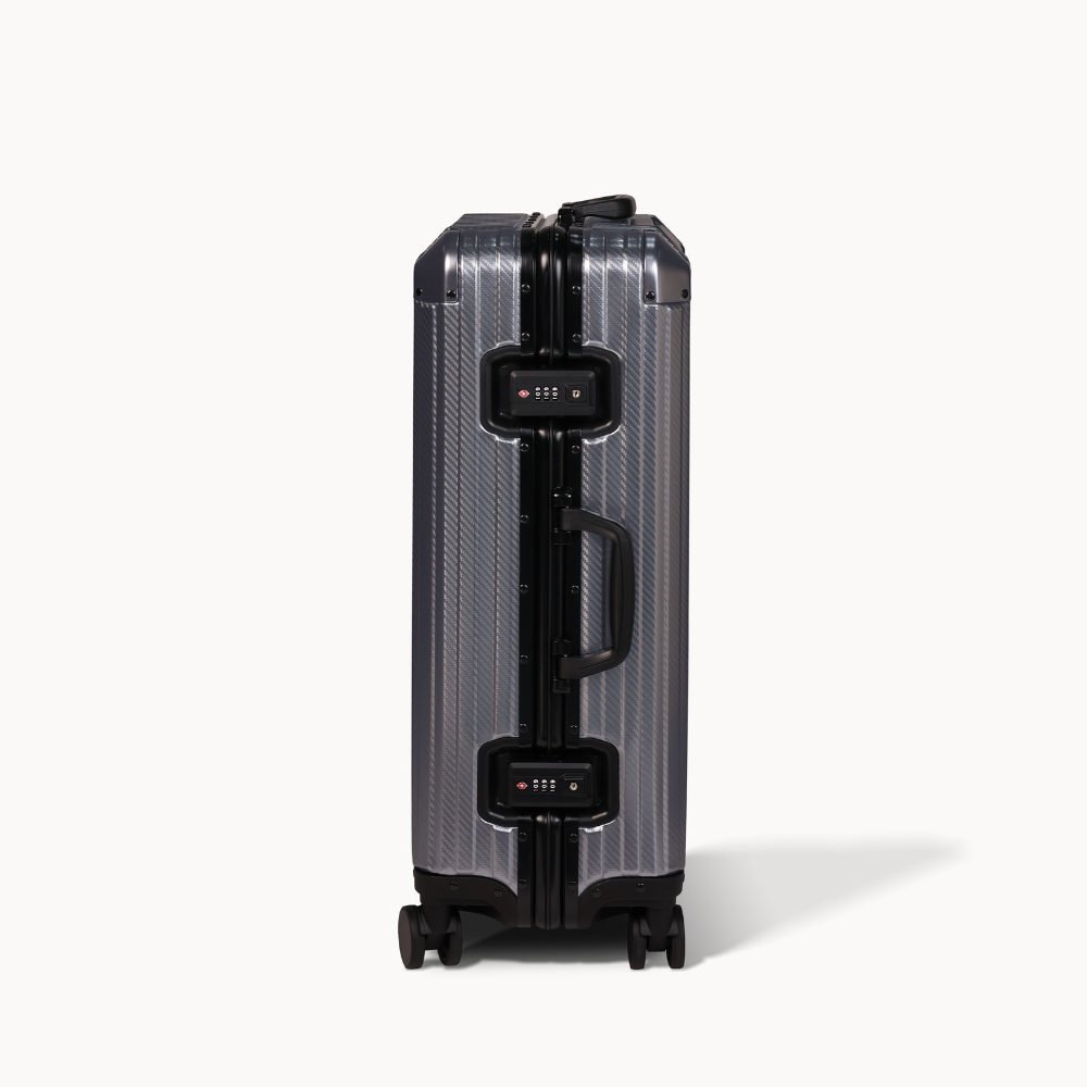 Silver suitcase with black accents on a white background