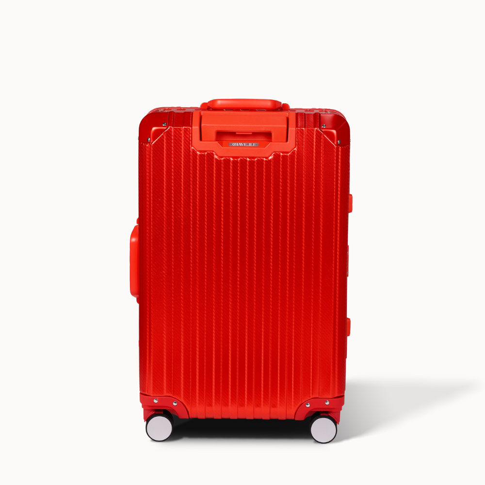 Red suitcase with a textured surface on a white background