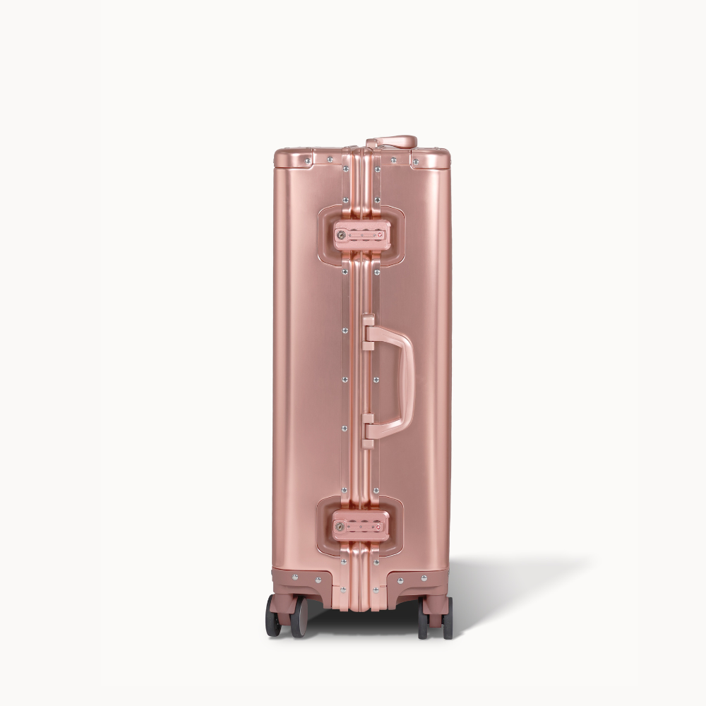 CHAVELLE aluminium suitcase rose gold close-up of TSA-approved lock and side handle