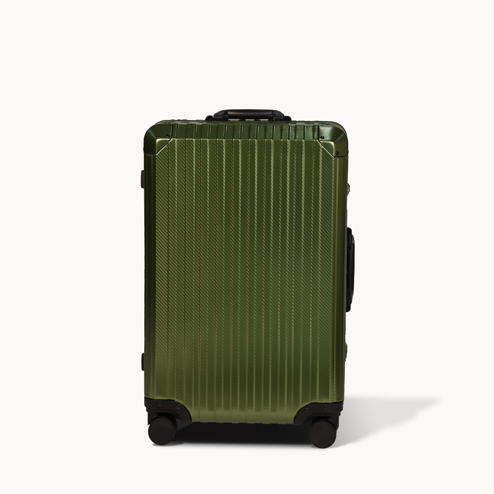 Green suitcase with black wheels on a white background