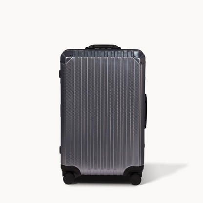 Silver suitcase with black accents on a white background